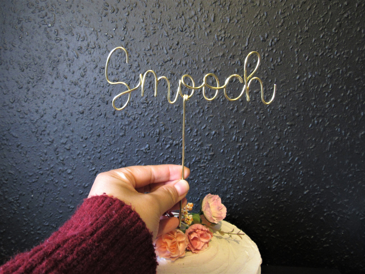 Smooch wedding cake topper
